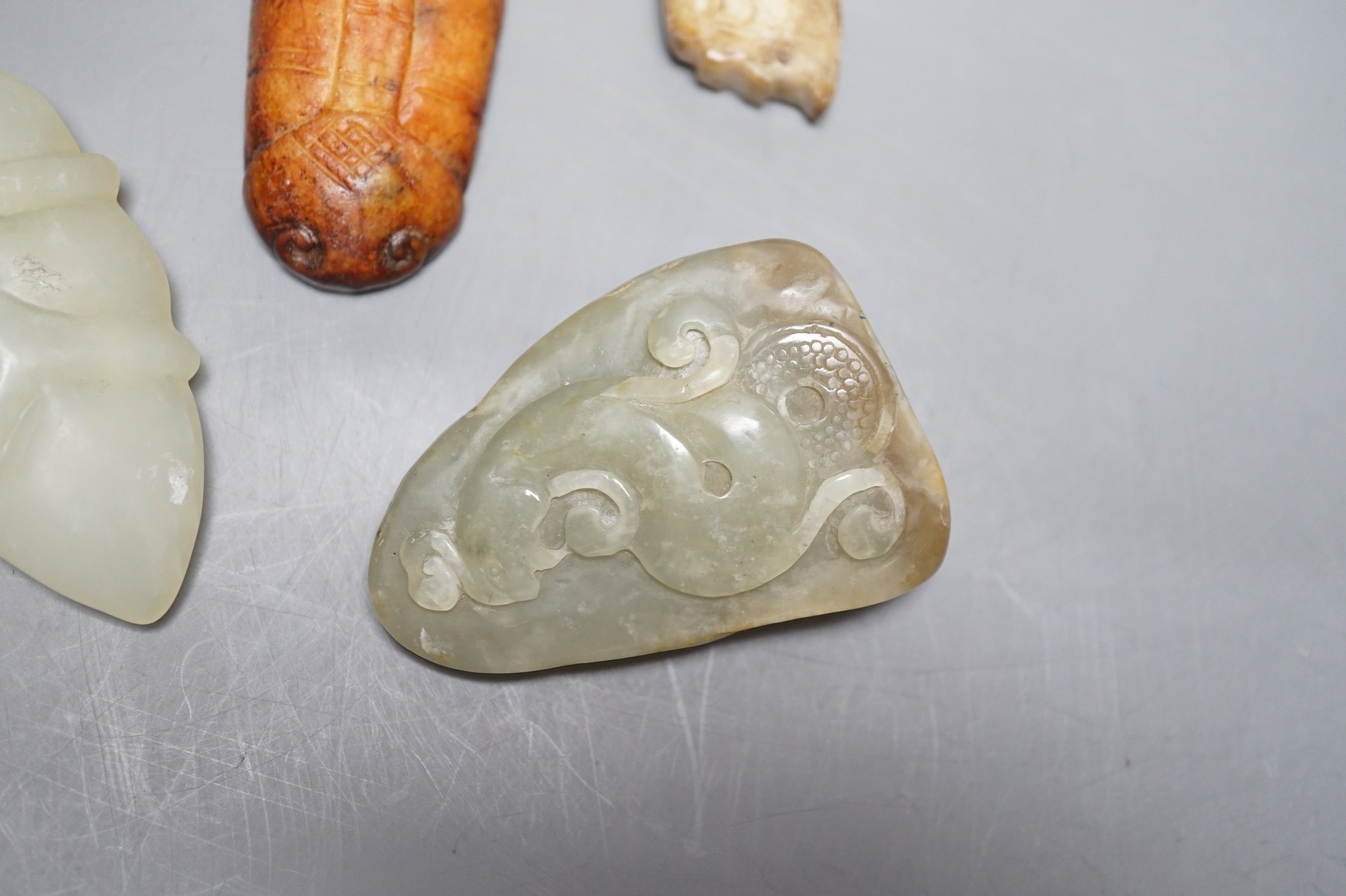 Four Chinese jade carvings, largest 11cm